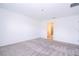 Spacious bedroom with gray carpet and en-suite bathroom access at 4278 Green Gables Pl, Kissimmee, FL 34746