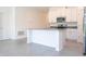 Open concept kitchen with island, stainless steel appliances, and white cabinets at 4278 Green Gables Pl, Kissimmee, FL 34746