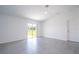 Bright living room with tile floors and sliding glass doors leading to backyard at 4278 Green Gables Pl, Kissimmee, FL 34746