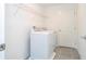 Laundry room with washer, dryer, and overhead shelving at 4278 Green Gables Pl, Kissimmee, FL 34746