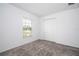 Bright bedroom with gray carpet and large closet at 4278 Green Gables Pl, Kissimmee, FL 34746