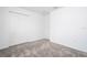 Simple bedroom with grey carpet, double door closet, and an additional door at 4278 Green Gables Pl, Kissimmee, FL 34746