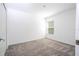 Spacious bedroom featuring grey carpet and a window allowing natural light at 4278 Green Gables Pl, Kissimmee, FL 34746