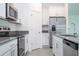 Modern kitchen with stainless steel appliances and white cabinets at 4278 Green Gables Pl, Kissimmee, FL 34746