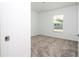 Small bedroom with gray carpet and large closet at 4278 Green Gables Pl, Kissimmee, FL 34746