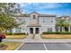 Two-story townhome with a well-manicured lawn at 4838 Romeo Cir, Kissimmee, FL 34746