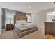 Spacious main bedroom with king-size bed and ensuite bathroom at 4838 Romeo Cir, Kissimmee, FL 34746