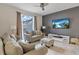 Relaxing living room featuring a comfortable sofa and ottoman, perfect for lounging at 4838 Romeo Cir, Kissimmee, FL 34746