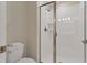 Clean bathroom with a walk in shower and toilet at 4838 Romeo Cir, Kissimmee, FL 34746