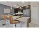 Modern kitchen with island, stainless steel appliances at 4838 Romeo Cir, Kissimmee, FL 34746