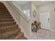 Modern staircase with neutral carpeting and a simple, clean design at 4838 Romeo Cir, Kissimmee, FL 34746