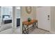 Bright entryway with tile flooring and a console table at 4838 Romeo Cir, Kissimmee, FL 34746