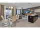 Bright dining area with a table and chairs, open to the kitchen and living room at 4838 Romeo Cir, Kissimmee, FL 34746
