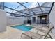 Private screened-in pool with safety fence and lounge chairs at 4838 Romeo Cir, Kissimmee, FL 34746
