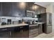 Kitchen with stainless steel appliances and white cabinets at 4838 Romeo Cir, Kissimmee, FL 34746