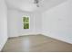 Bright bedroom with hardwood floors, a ceiling fan and window at 1840 Biscayne Dr, Winter Park, FL 32789