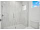 Modern bathroom with a large walk-in shower and white tile at 1840 Biscayne Dr, Winter Park, FL 32789