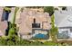 Top-down view of the house, pool, and surrounding landscape at 10527 Emerald Chase Dr, Orlando, FL 32836