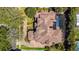 House's roofline, pool, and patio are visible from above at 10527 Emerald Chase Dr, Orlando, FL 32836