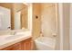 Bright bathroom featuring a vanity, shower, and bathtub at 10527 Emerald Chase Dr, Orlando, FL 32836
