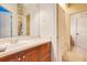 Clean bathroom with vanity, shower, and ample storage at 10527 Emerald Chase Dr, Orlando, FL 32836