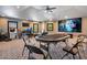 Fun game room perfect for entertainment with a large screen and seating at 10527 Emerald Chase Dr, Orlando, FL 32836