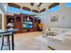 Gathering room with built-in entertainment center and comfortable seating at 10527 Emerald Chase Dr, Orlando, FL 32836