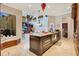 Large kitchen island with granite countertops, perfect for entertaining at 10527 Emerald Chase Dr, Orlando, FL 32836