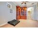 Spacious library with built-in wooden shelving and carpeting at 10527 Emerald Chase Dr, Orlando, FL 32836