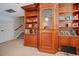 Built-in wooden bookcase and shelving in a home library or study at 10527 Emerald Chase Dr, Orlando, FL 32836