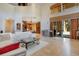 Open living space with a large sectional sofa and access to the outdoors at 10527 Emerald Chase Dr, Orlando, FL 32836