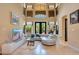 Spacious living area with sectional sofa and large windows at 10527 Emerald Chase Dr, Orlando, FL 32836