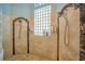 Large walk-in shower with double shower heads and tile surround at 10527 Emerald Chase Dr, Orlando, FL 32836