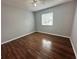 Bedroom with wood-look flooring and neutral-toned walls at 1123 Spring Meadow Dr # 1123, Kissimmee, FL 34741