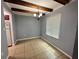 Dining area with tile floors, wood beams, and neutral-toned walls at 1123 Spring Meadow Dr # 1123, Kissimmee, FL 34741