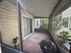 Screened-in porch with concrete flooring and space for outdoor grilling at 1123 Spring Meadow Dr # 1123, Kissimmee, FL 34741