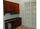 Home office features built-in wooden desk and shelving at 136 Osprey Hammock Trl, Sanford, FL 32771