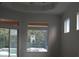 Gathering room with pool access and multiple windows at 136 Osprey Hammock Trl, Sanford, FL 32771