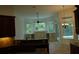 Kitchen with island, dark wood cabinets, and granite countertops at 136 Osprey Hammock Trl, Sanford, FL 32771