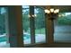 Bright dining room with pool view and elegant chandelier at 136 Osprey Hammock Trl, Sanford, FL 32771