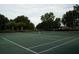 Pair of tennis courts surrounded by trees at 136 Osprey Hammock Trl, Sanford, FL 32771