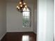 Elegant dining room with hardwood floors and chandelier at 136 Osprey Hammock Trl, Sanford, FL 32771