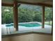 Inviting pool and spa area with screened enclosure at 136 Osprey Hammock Trl, Sanford, FL 32771