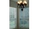 Bright dining area with chandelier and window blinds at 136 Osprey Hammock Trl, Sanford, FL 32771
