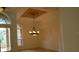 Elegant dining room with chandelier and arched windows at 136 Osprey Hammock Trl, Sanford, FL 32771
