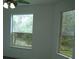 Bedroom with two large windows and ceiling fan at 136 Osprey Hammock Trl, Sanford, FL 32771