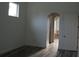 Spacious bedroom with dark wood flooring and en-suite bathroom at 136 Osprey Hammock Trl, Sanford, FL 32771