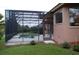 Side view of the home's screened pool area at 136 Osprey Hammock Trl, Sanford, FL 32771