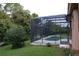 View of the backyard pool and screened patio at 136 Osprey Hammock Trl, Sanford, FL 32771