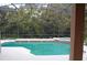 Inviting screened pool with tiled deck and spa at 136 Osprey Hammock Trl, Sanford, FL 32771